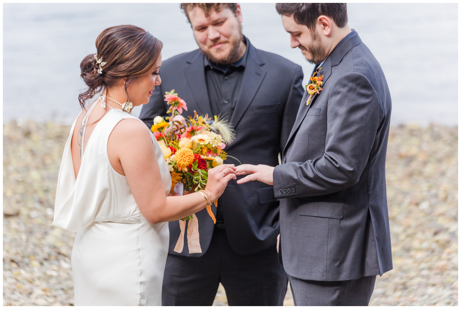 Bride putting ring on Groom Seabeck Elopement