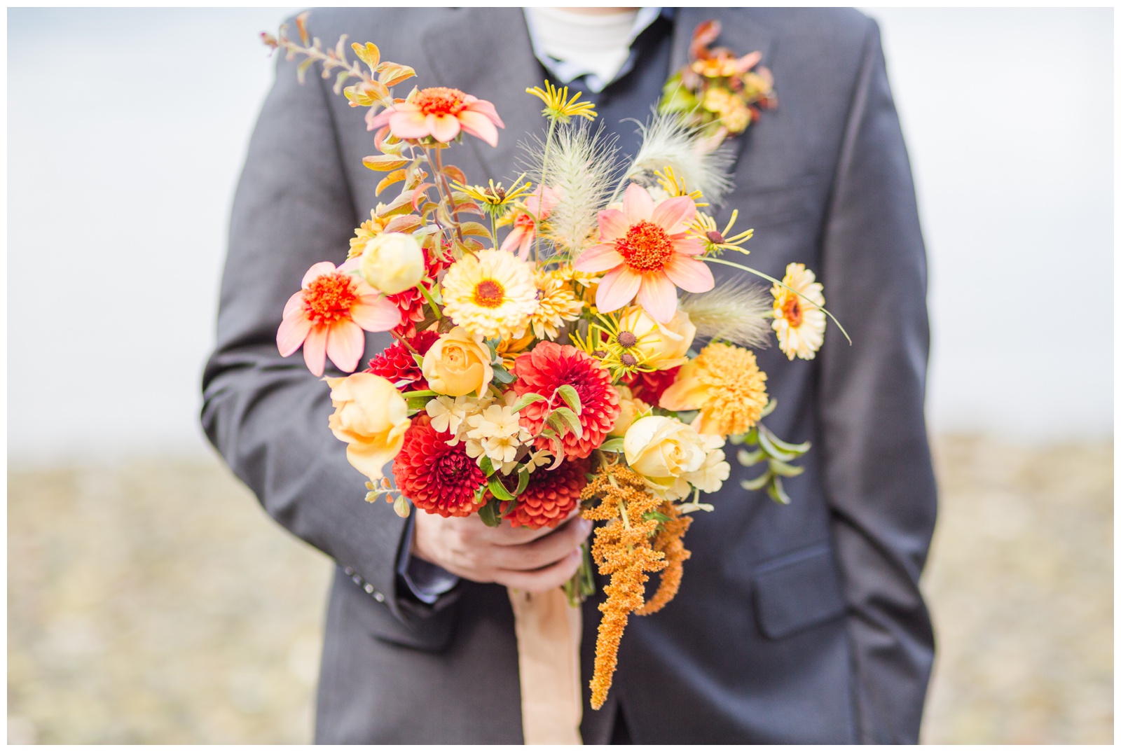 Groom holding wedding bouquet, Sebeck elopement